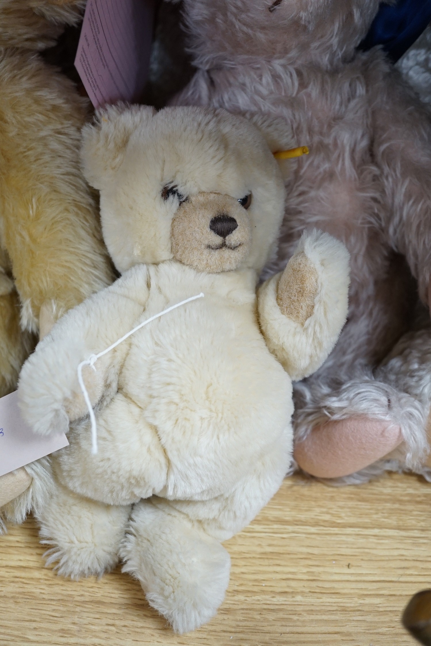 A large Steiff growler blonde plush teddy bear, 68cms long and four other Steiff teddy bears
